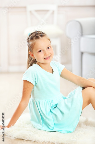 Little cute girl sitting on...