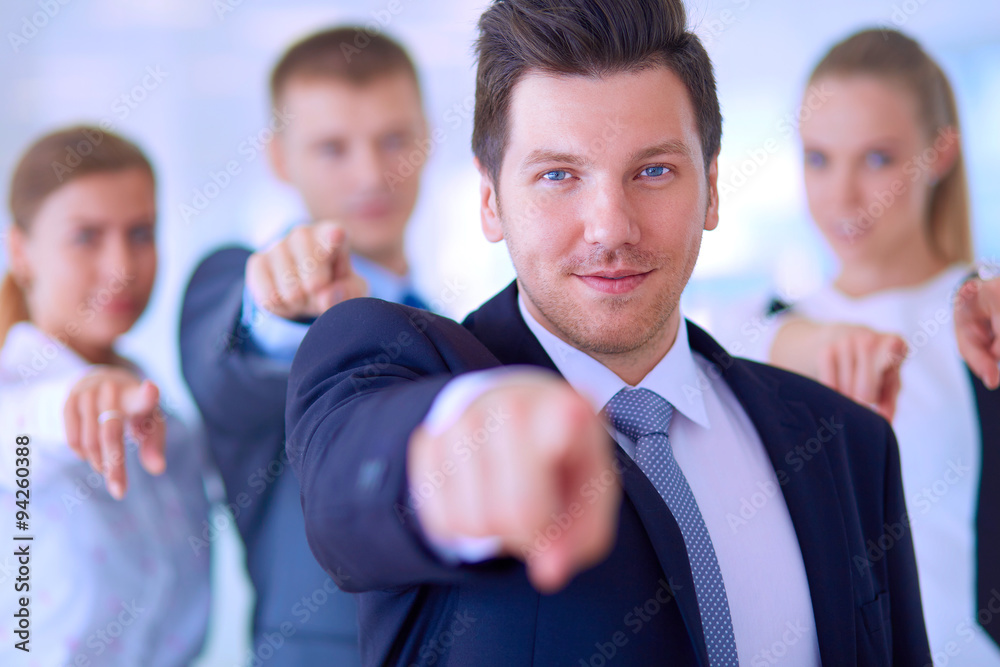 Group of business people pointing to you Group of business people pointing to you