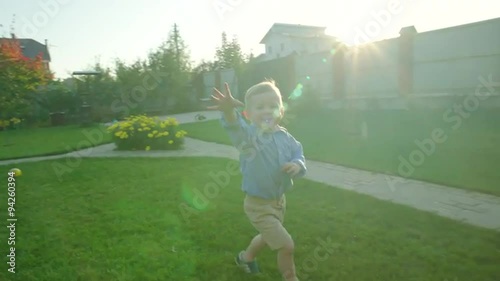 Little Boy Running and Having Fun photo