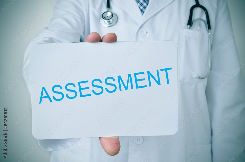 doctor showing a signboard with the word assessment doctor showing a signboard with the word assessment