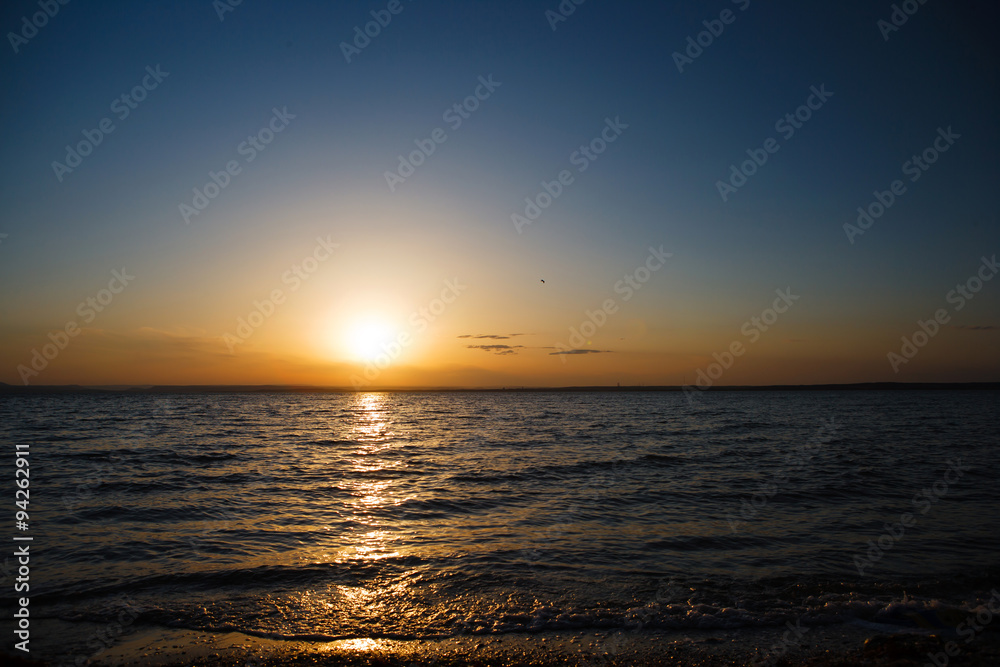Sunset over the sea, a beautiful evening ocean, water nature, wildlife of the sea, the horizon, a romantic trip, beach night, sea waves, coastal landscape, views of the sun. Sunset over the sea, a beautiful evening ocean, water nature, wildlife of the sea, the horizon, a romantic trip, beach night, sea waves, coastal landscape, views of the sun.