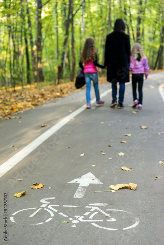 Family walking in autumn park