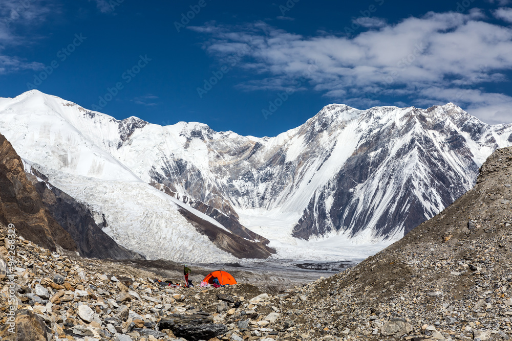 High Mountains Panorama with Red Tent on Glacier Moraine