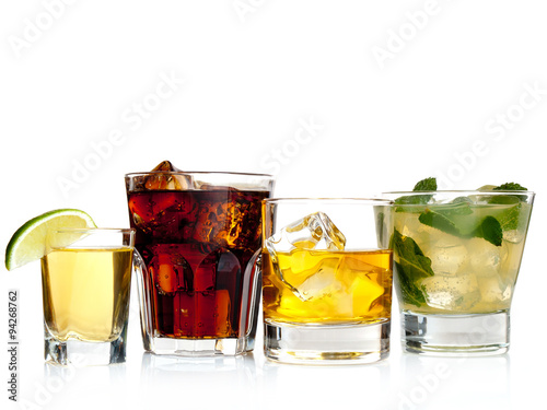 Various cocktails, drinks and shots over white background