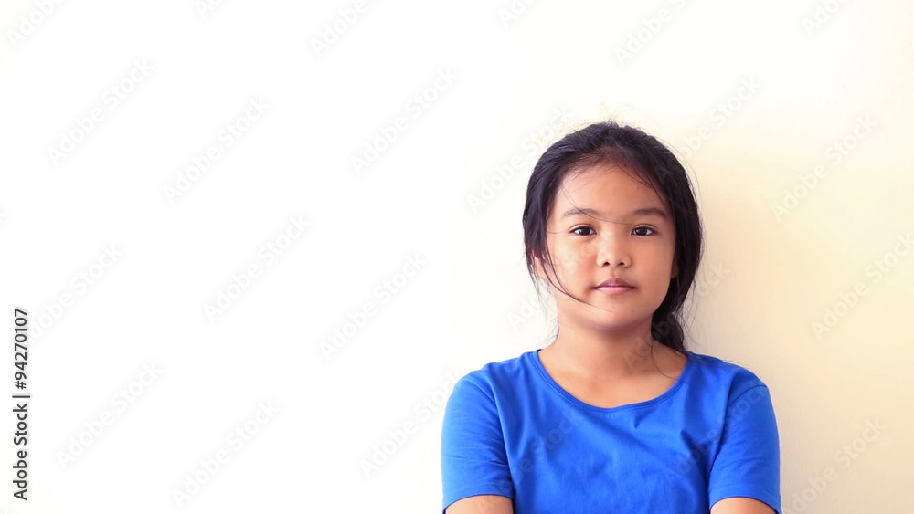 Asian teen standing with white wall Asian teen standing with white wall
