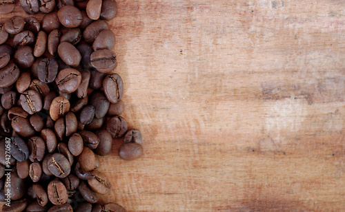 roasted coffee on a wooden background © bellakadife