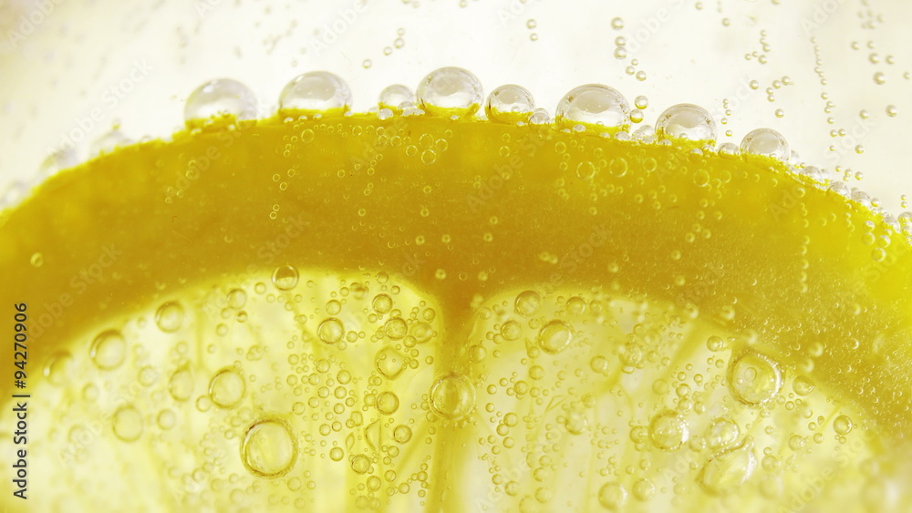 Lime slice in soda water. Macro close-up 4K UHD 2160p footage.
