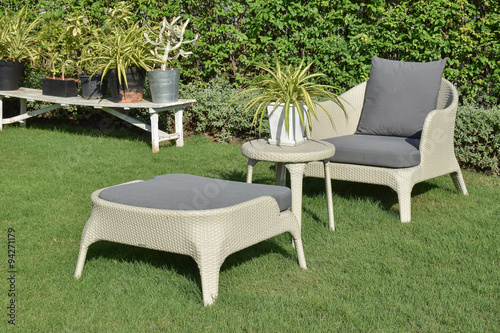 green garden with an outdoor furniture lounge group with rattan