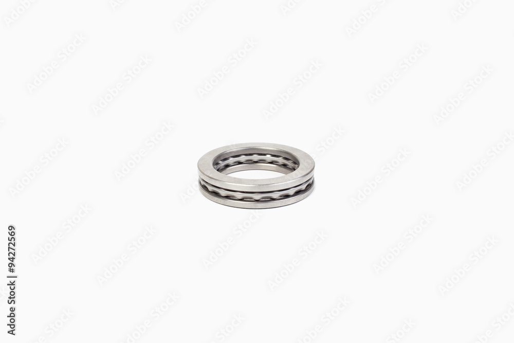Close-up bearings spare part of mechanical on the white background. Close-up bearings spare part of mechanical on the white background.