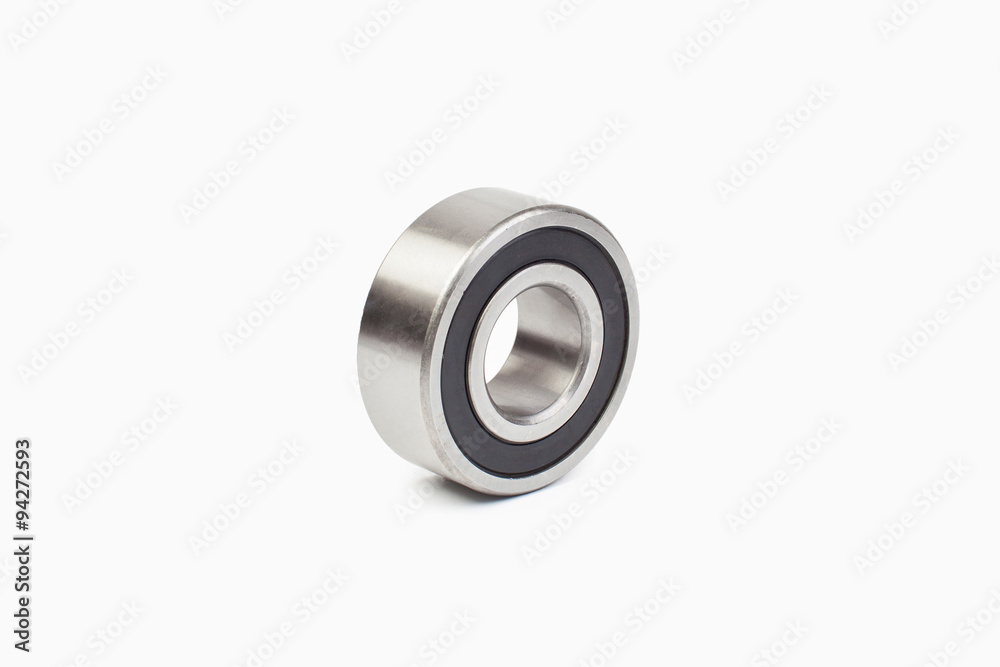Close-up bearings spare part of mechanical on the white background. Close-up bearings spare part of mechanical on the white background.