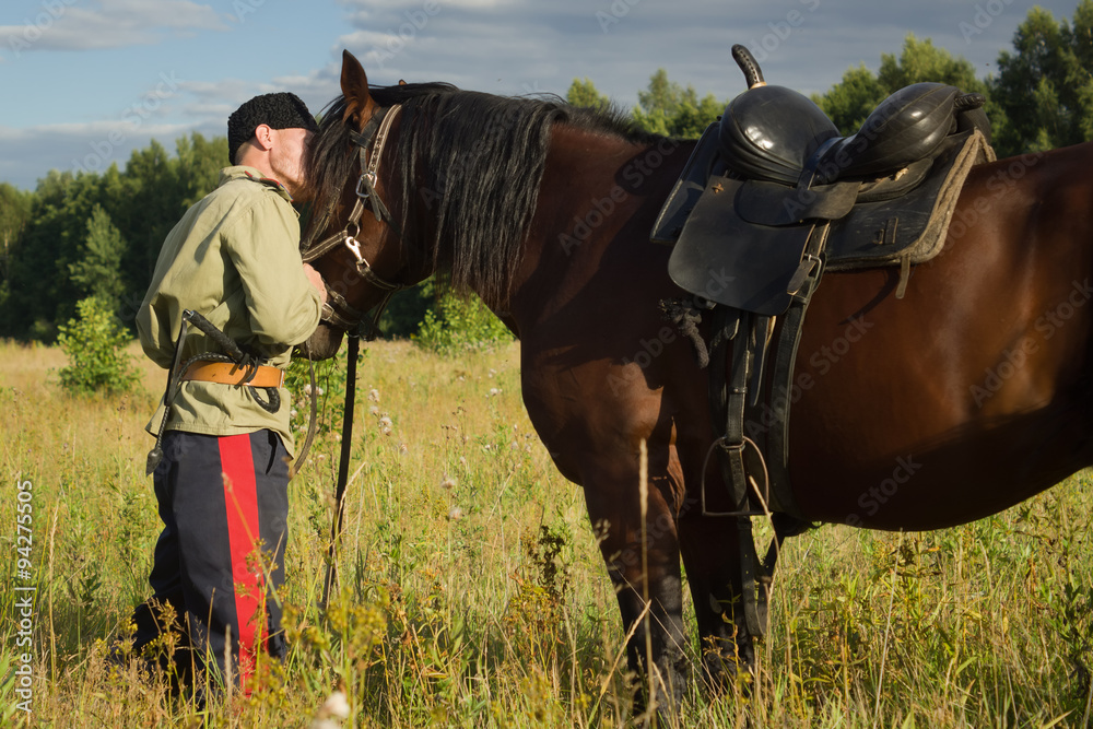 Russian Cossack with a horse resting in the summer field Stock Photo |  Adobe Stock