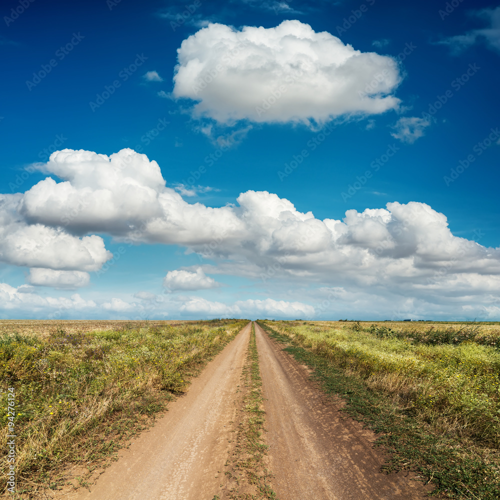 rural road and deep blue sky with clouds rural road and deep blue sky with clouds
