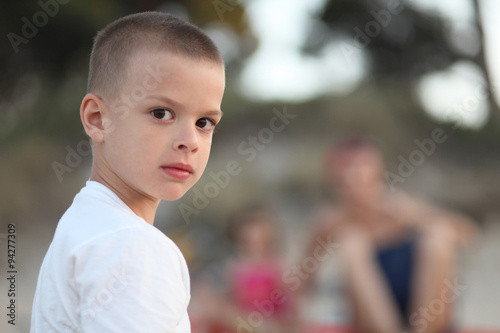 Young boy looking serious portrait