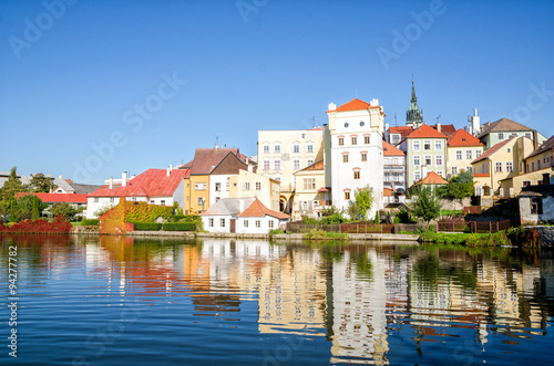 town houses reflecting in the lake