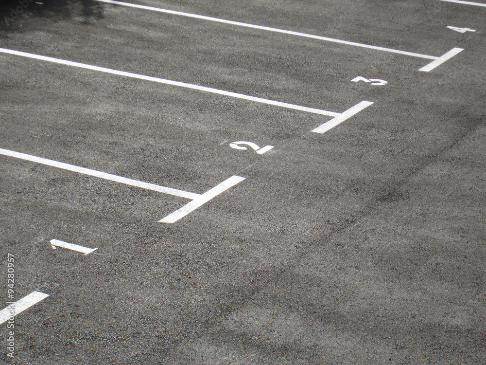 gray car park areas numbered from one to four