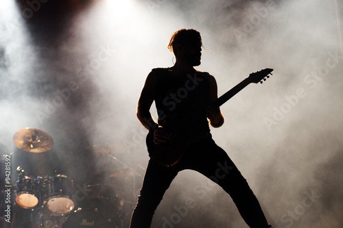 silhouette of a a guitarist on stage