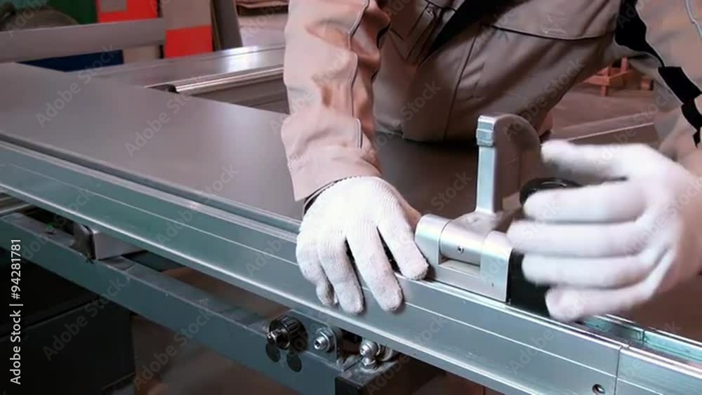 Modern sliding table saws woodworking machine at the woodworking and furniture plant for cutting of panels. A hand tool for cutting wood or other materials.