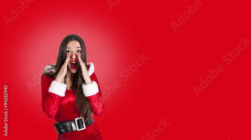 attractive girl with santa claus suit photo