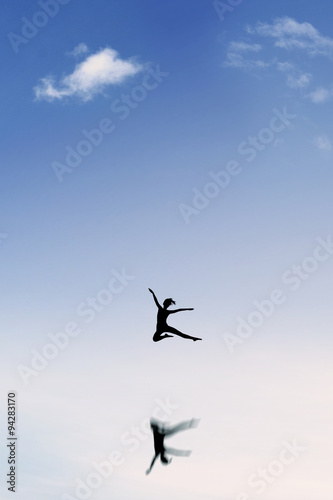 Attractive girl dancing on the sky