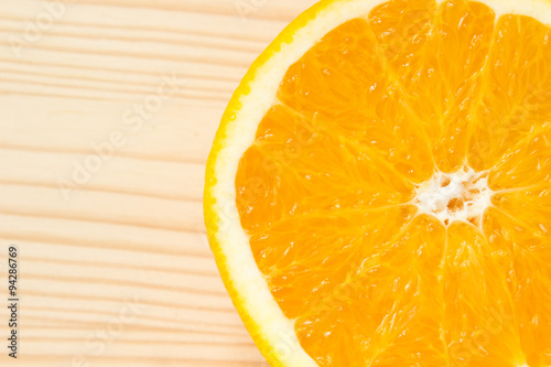 Sliced orange on wooden background