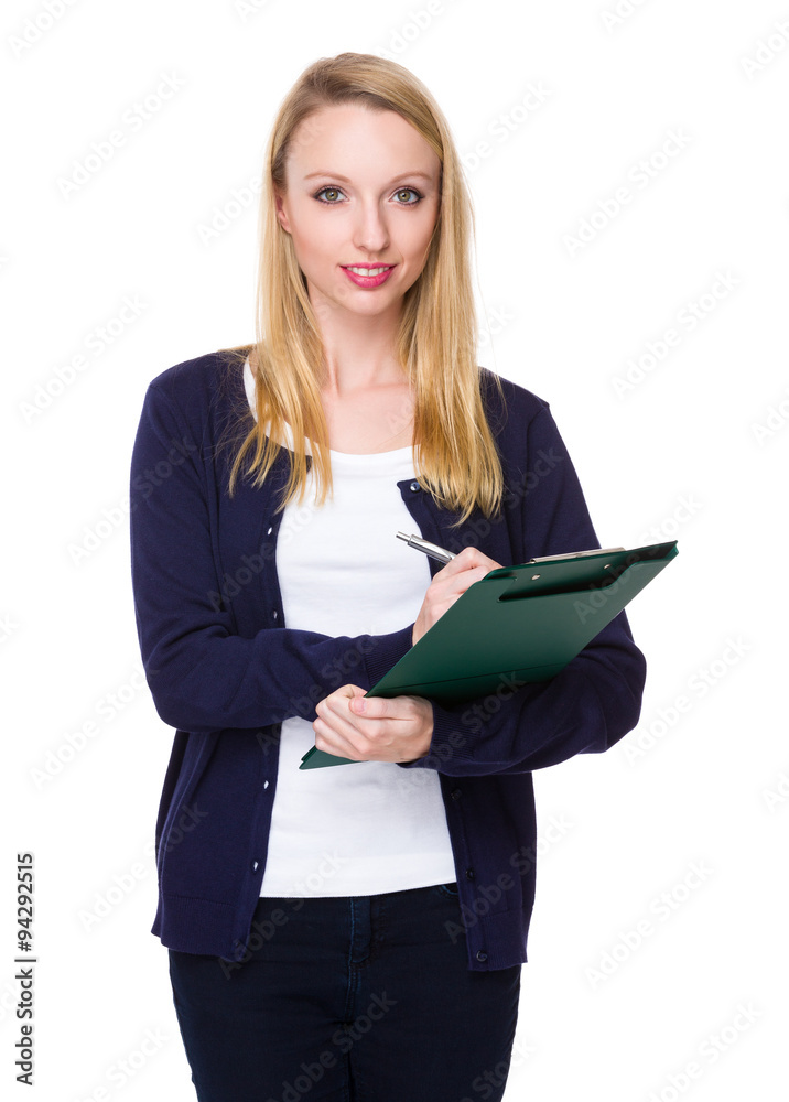 Young Woman take note on clipboard Young Woman take note on clipboard