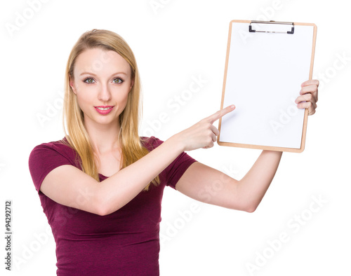 Young Woman with finger point to blank page of clipboard