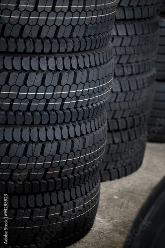 Stack of car tires on warehouse