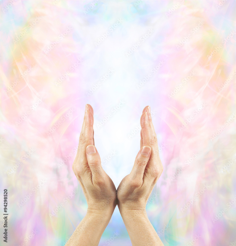 Channeling Angelic Healing Energy - Pair of female hands cupped upwards with a beautiful ethereal angelic energy field and white light Channeling Angelic Healing Energy - Pair of female hands cupped upwards with a beautiful ethereal angelic energy field and white light
