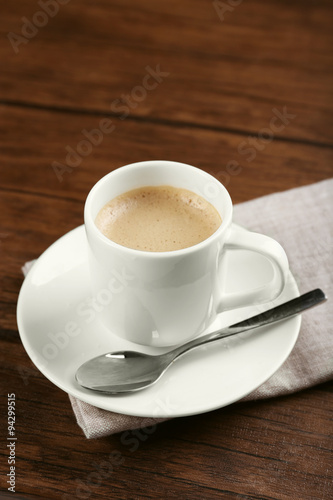 Fototapeta Naklejka Na Ścianę i Meble -  Cup of coffee on table close up