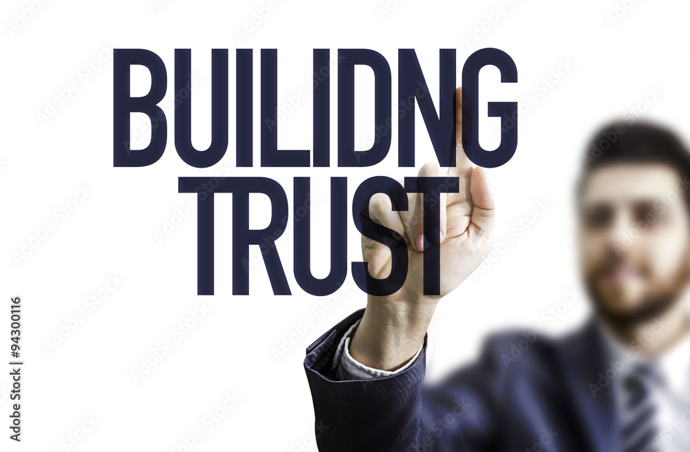 Business man pointing the text: Building Trust Business man pointing the text: Building Trust