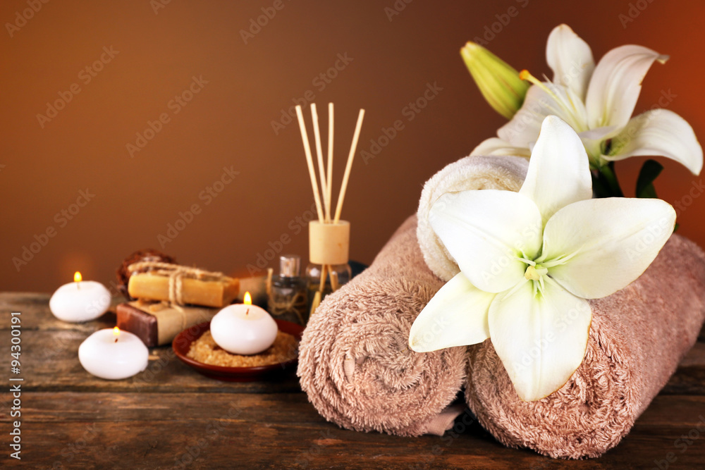 Beautiful spa composition with lily on brown background Beautiful spa composition with lily on brown background