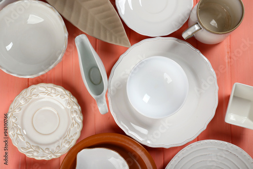 Different tableware on wooden table close up