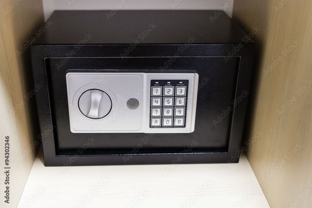 closed safe on shelf of cabinet closed safe on shelf of cabinet