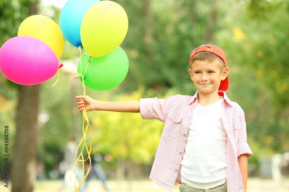 Little boy with balloons in the park Little boy with balloons in the park