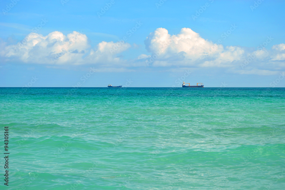 Cargo Ships on the Horizon on a gorgeous Miami Beach Cargo Ships on the Horizon on a gorgeous Miami Beach