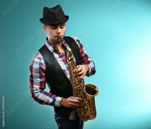 Saxophone player on blue background