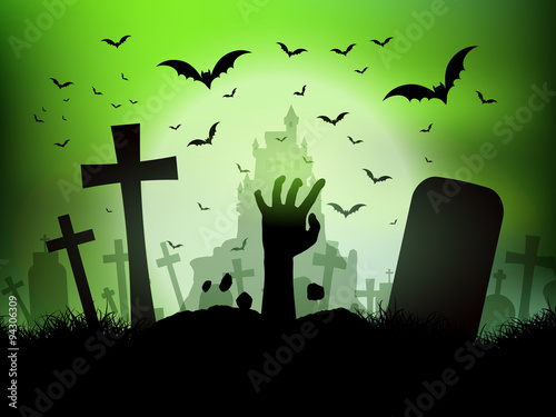 Halloween landscape with zombie hand in graveyard