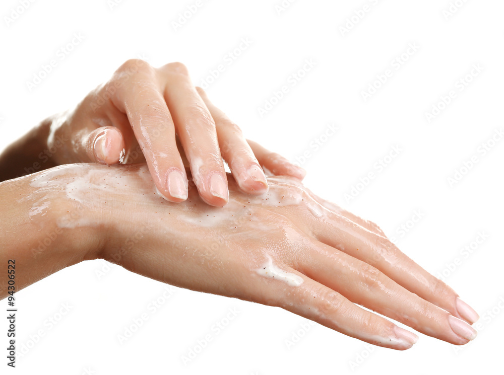 Woman's hands using scrub isolated on white Woman's hands using scrub isolated on white
