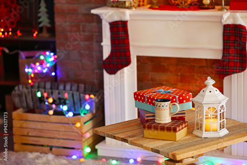 Fireplace with beautiful Christmas decorations in comfortable living room