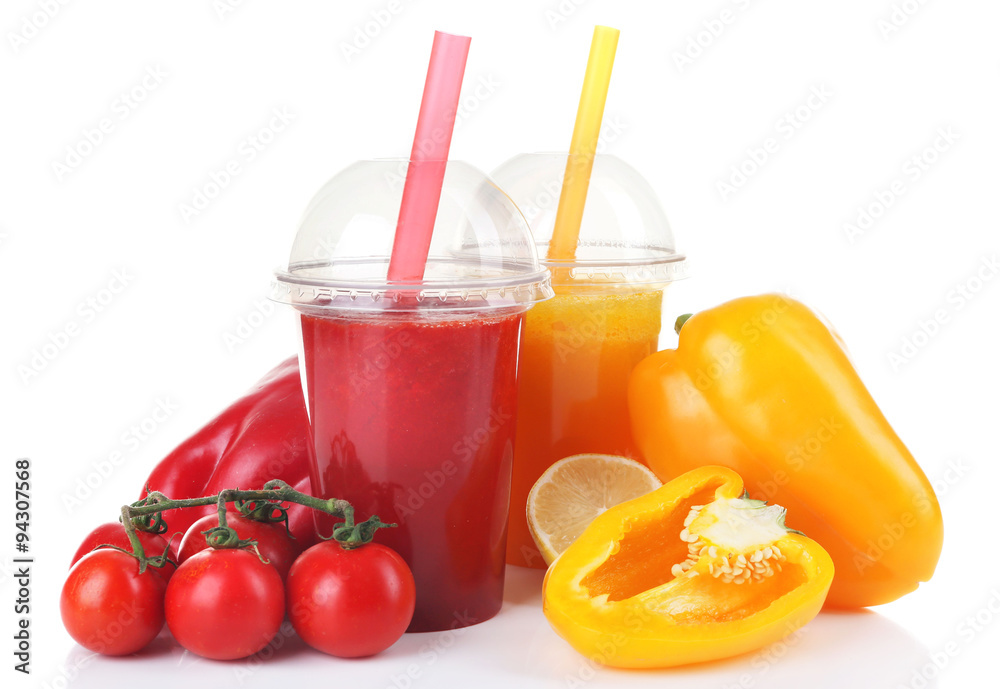 Fresh vegetable juices in plastic cups isolated on white Fresh vegetable juices in plastic cups isolated on white