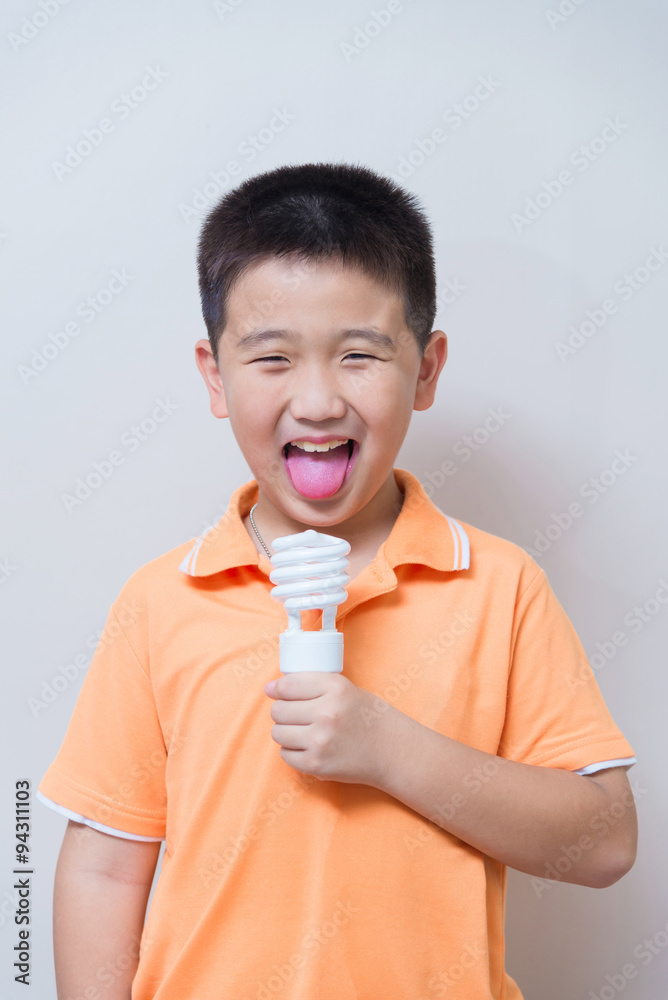 Asian boy joking gesture licking fake ice cream made with energy Asian boy joking gesture licking fake ice cream made with energy