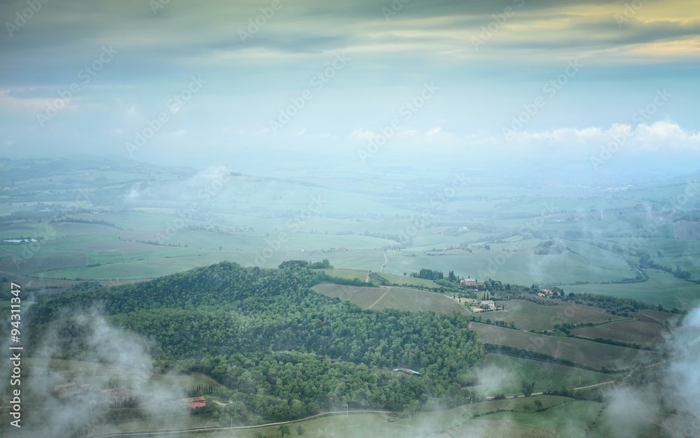 Tuscan countryside in morning mist