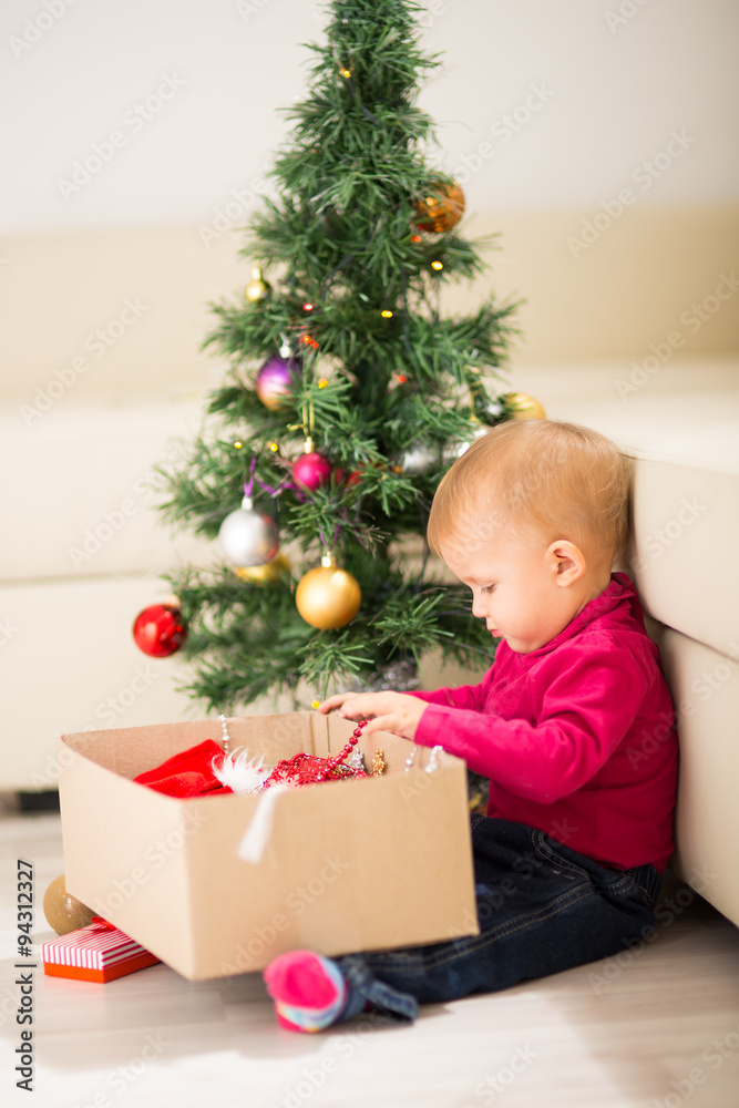 Baby near Christmas tree Baby near Christmas tree