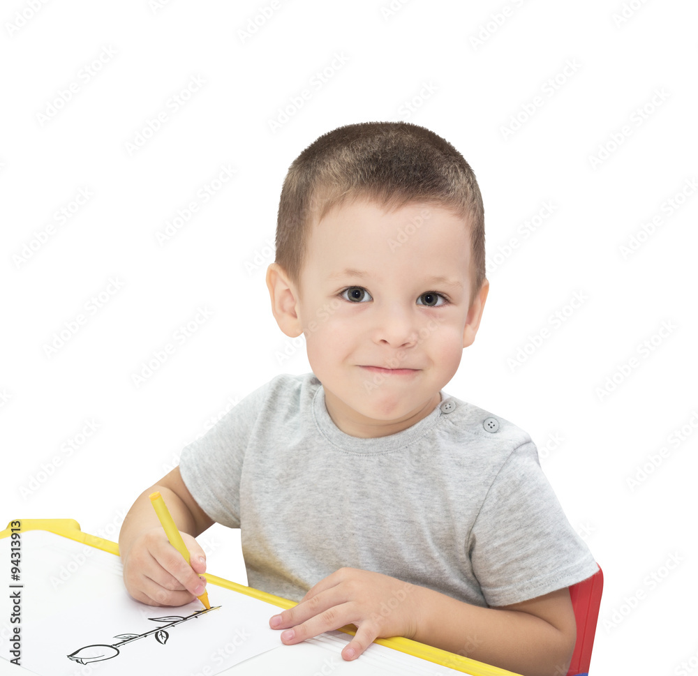 Boy drawing with pencil isolated on the white background Boy drawing with pencil isolated on the white background