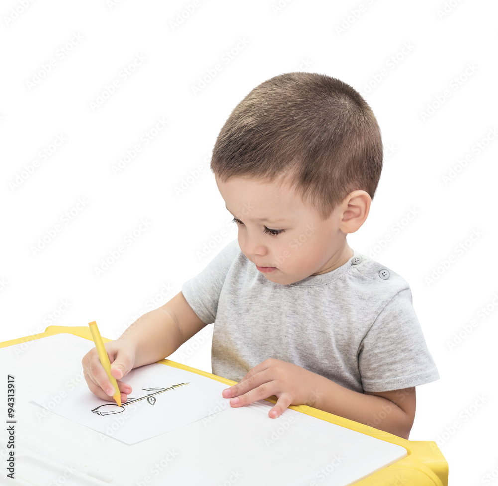 Boy drawing with pencil isolated on the white background Boy drawing with pencil isolated on the white background