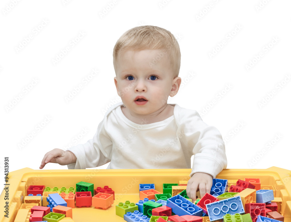 child playing in the plastic constructor isolated on the white child playing in the plastic constructor isolated on the white