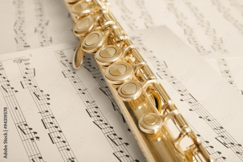 Obraz premium Flute on music notes background