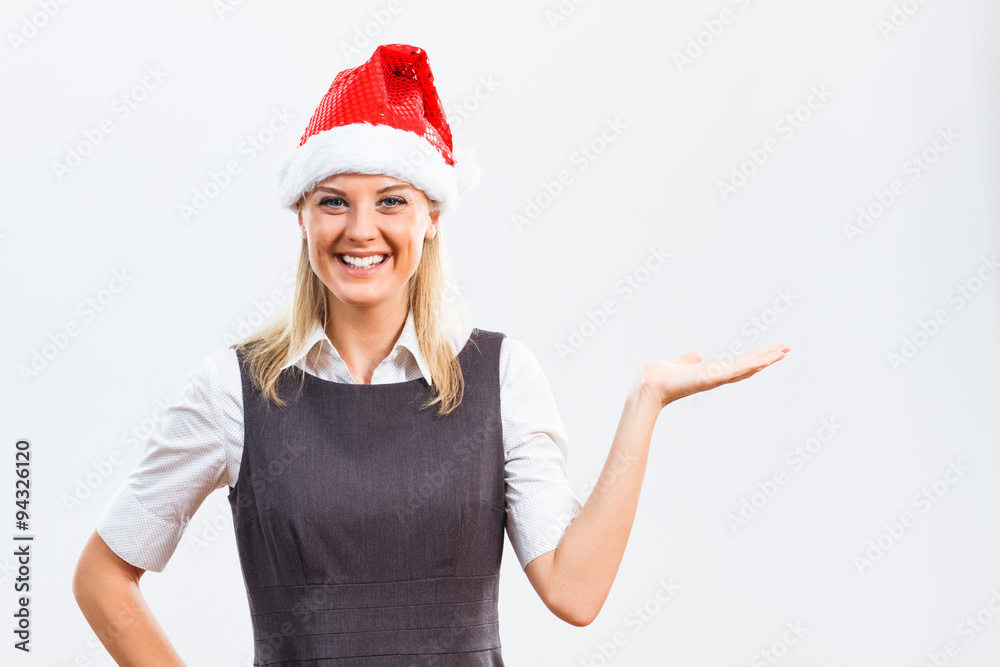 Business woman with Santa Hat holding your product Business woman with Santa Hat holding your product