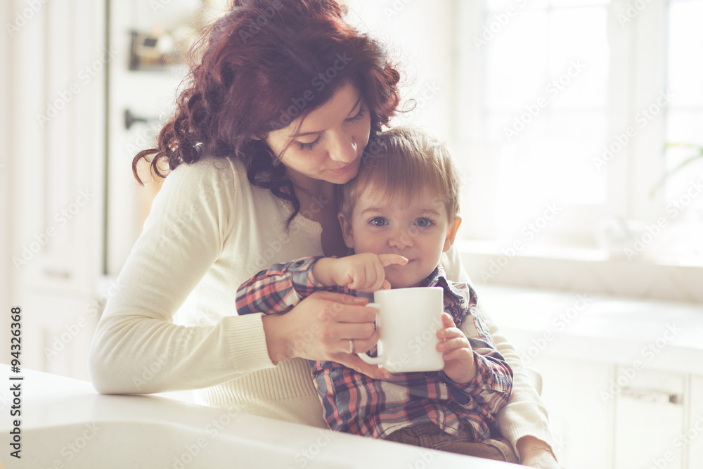 © Alena Ozerova - Mother and child eating in the kitchen © Alena Ozerova - Mother and child eating in the kitchen