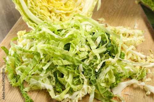 Cut savoy cabbage on cutting board closeup